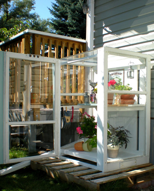 Build a small outdoor greenhouse out of reclaimed storm windows.